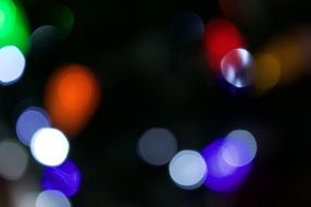colored dots on black background