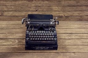 vintage typewriter on the wooden table