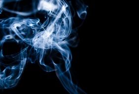 blue smoke on black background