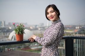 asian model posing in floral dress