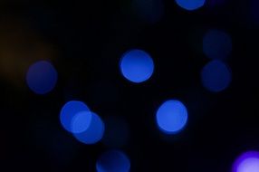 black blurred background with blue highlights
