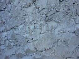wet cement on the wall
