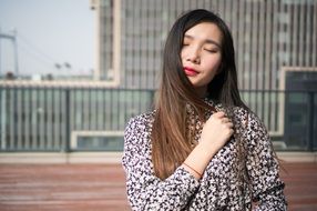 asian model posing with closed eyes