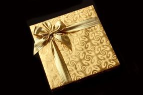 present box in golden packaging paper