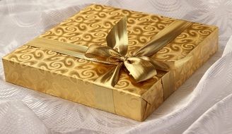 present box wrapped in golden paper