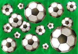 painted soccer balls on a green background