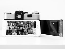 Iphone and digital camera in black and white