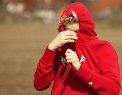 young woman in red hoodie