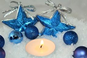 lit candle and Christmas decorations