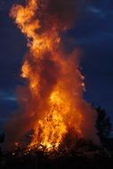 bonfire with smoke against the sky