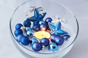 blue Christmas decorations in the glass bowl