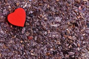 red heart lies on the colorful stones
