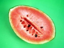 piece of watermelon on green background