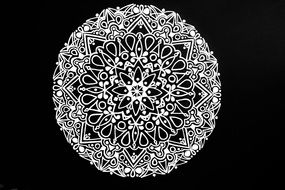 mandala white flower on the black background