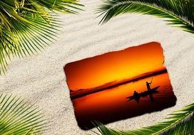 sunset card lies in the sand