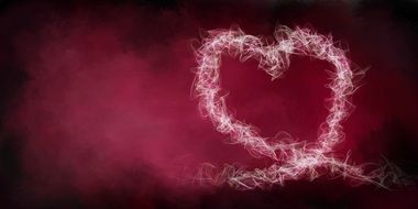 heart on pink smoke on black background