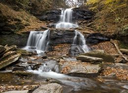 water cascade in the autumn forest