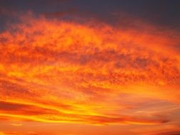 orange clouds in the sky at sunset