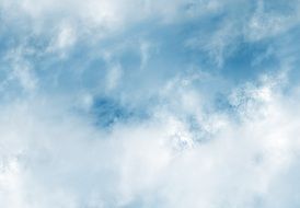 white clouds in the blue sky close up