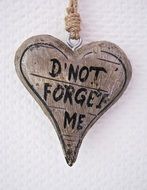 wooden heart with inscription do not forget me