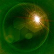yellow light flare on a green background