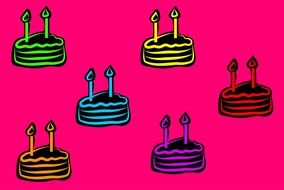 painted cakes on a pink background