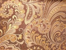 gold pattern on brown wallpaper