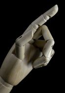 wooden hand with index finger up
