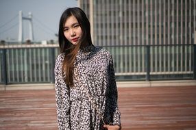 charming asian woman posing outdoor