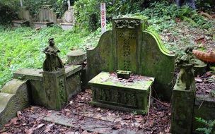 stone statue in a graveyard