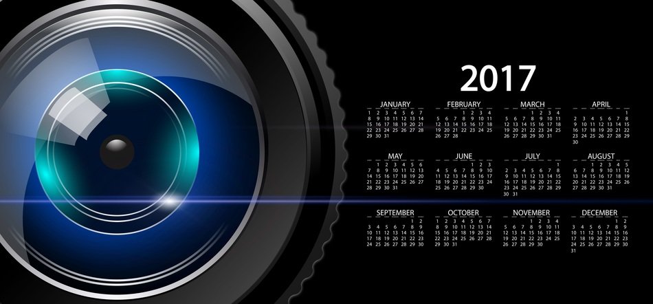 lens near the calendar on a black background