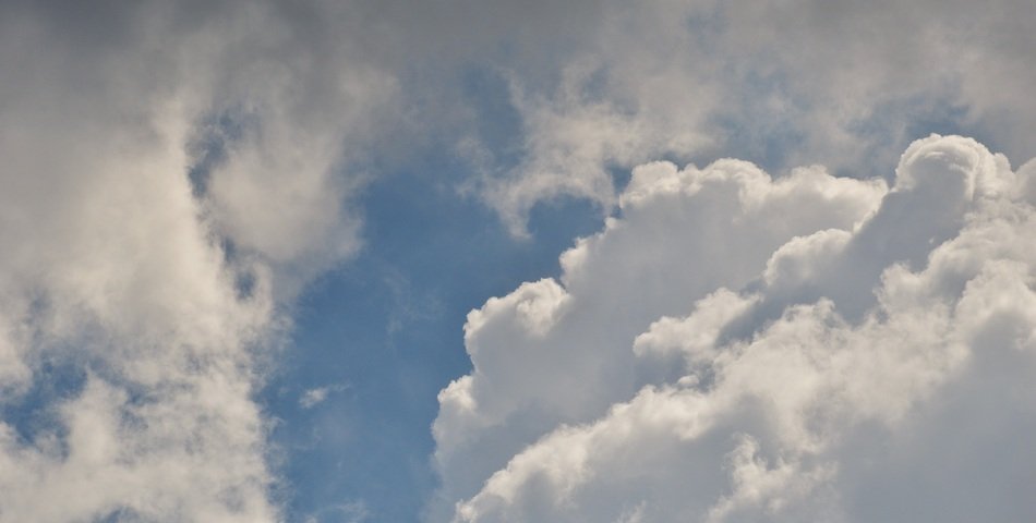 background with cumulus clouds on the blue sky