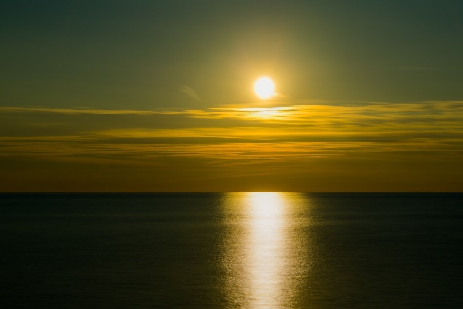 sun in the sunset above the clouds