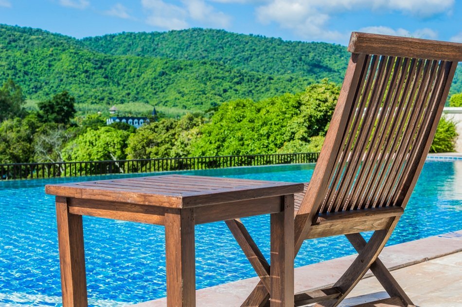 wooden furniture on the pool deck