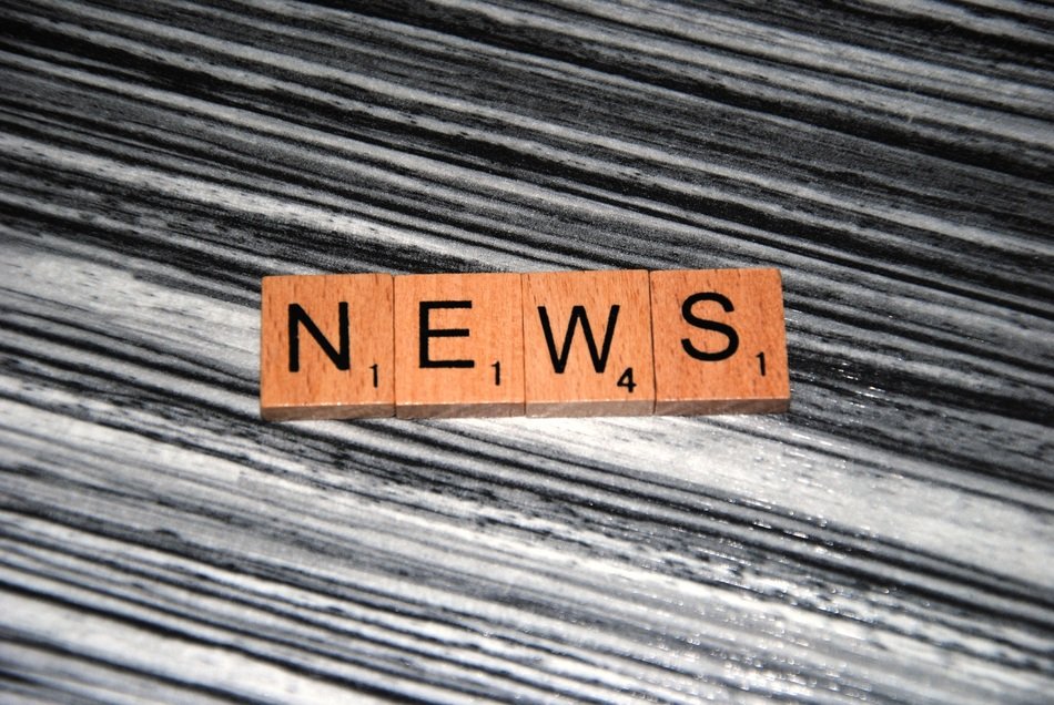 word news on dark stripes background