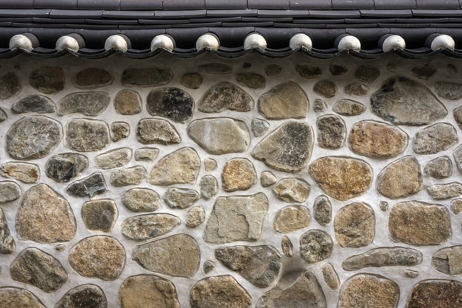 stone wall under the roof