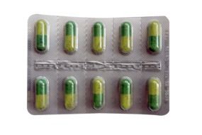 yellow-green pills on blister