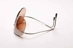 sunglasses on a white surface