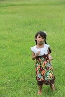 girl posing on green grass