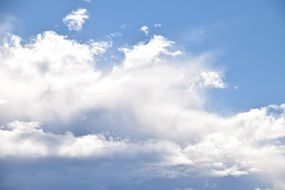 white clouds on a light blue sky