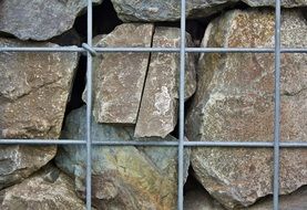 stone wall with metal fence