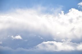 bright clouds in the blue sky