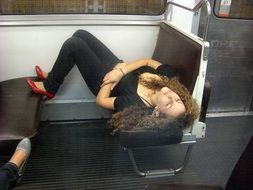 Young Woman Sleeping On The Subway