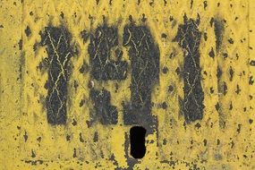 black numbers on the old metal shield