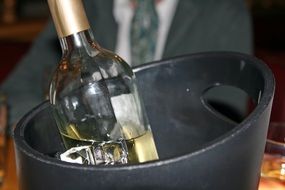 bottle of alcohol in a bucket