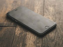 modern smartphone on the wooden table