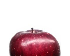 part of red apple on a white background