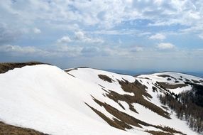 snow on the top of the mountain in winter