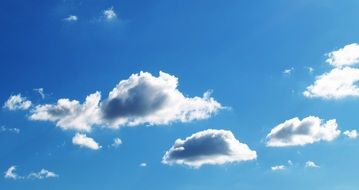 bright sunny blue sky with white clouds