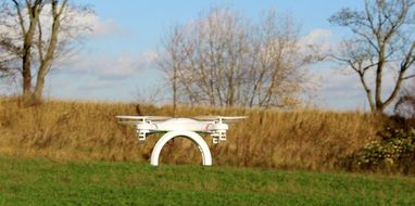 drone flying over green grass